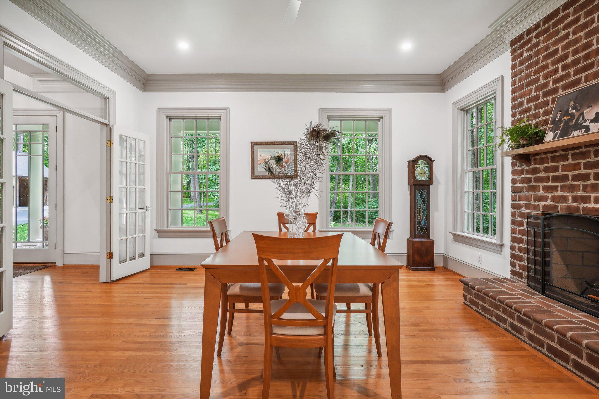 8683 Reservoir Road Fulton, MD 20759 - Photo 25 of 60 a view of a dining room with furniture window and wooden floor