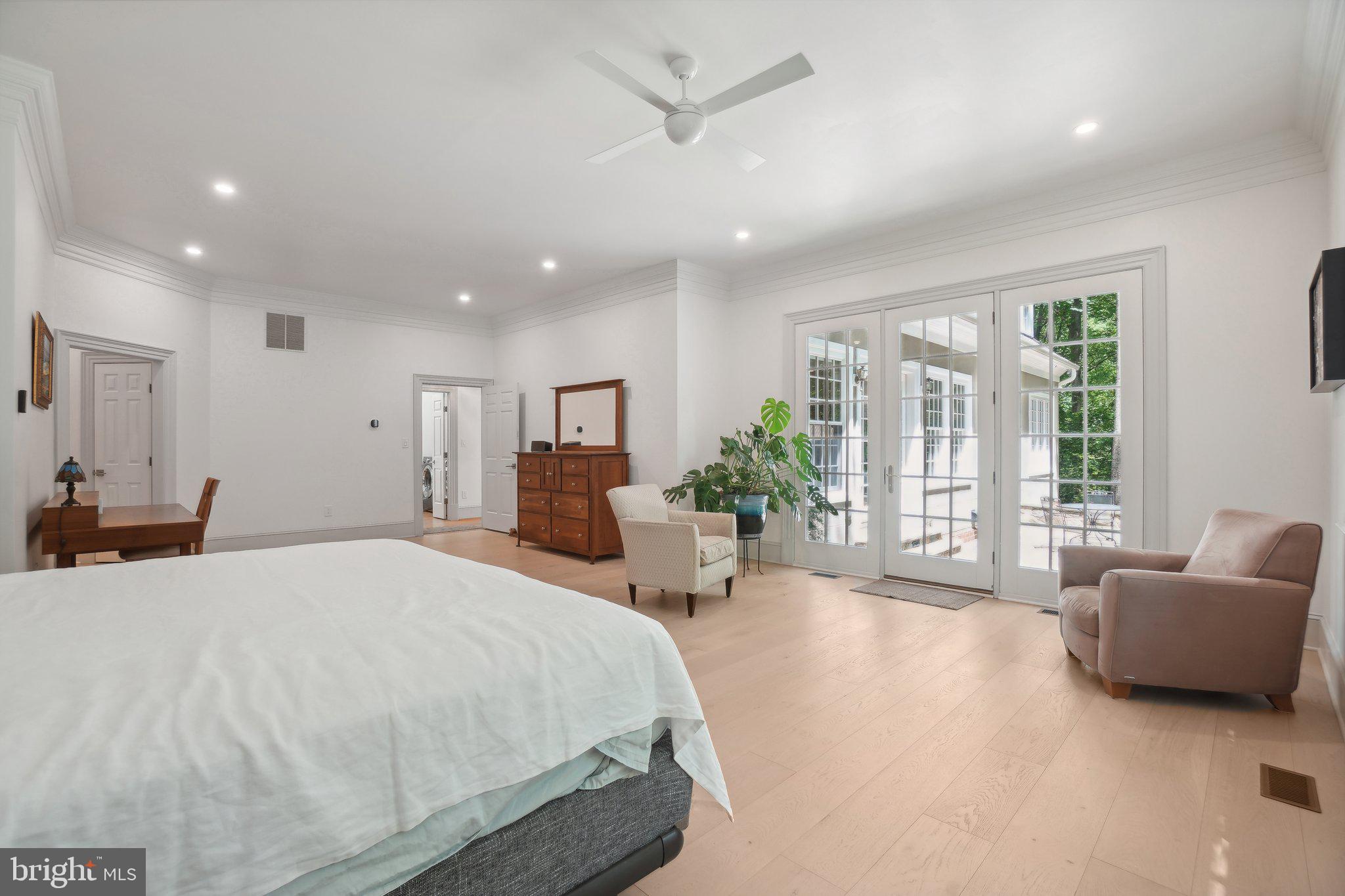 8683 Reservoir Road Fulton, MD 20759 - Photo 30 of 60 a spacious bedroom with a large bed and a couch