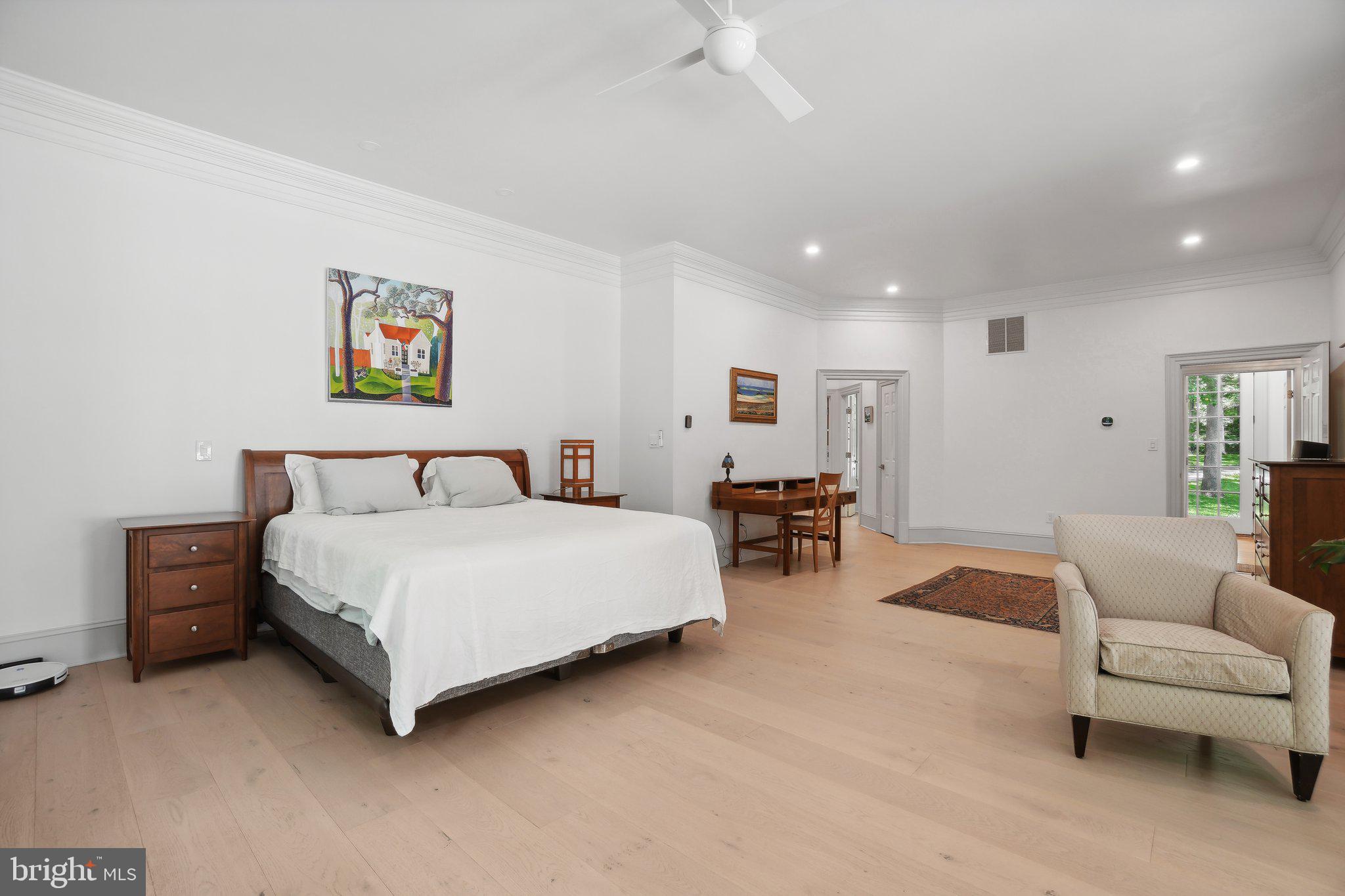 8683 Reservoir Road Fulton, MD 20759 - Photo 31 of 60 a spacious bedroom with a bed and a couch