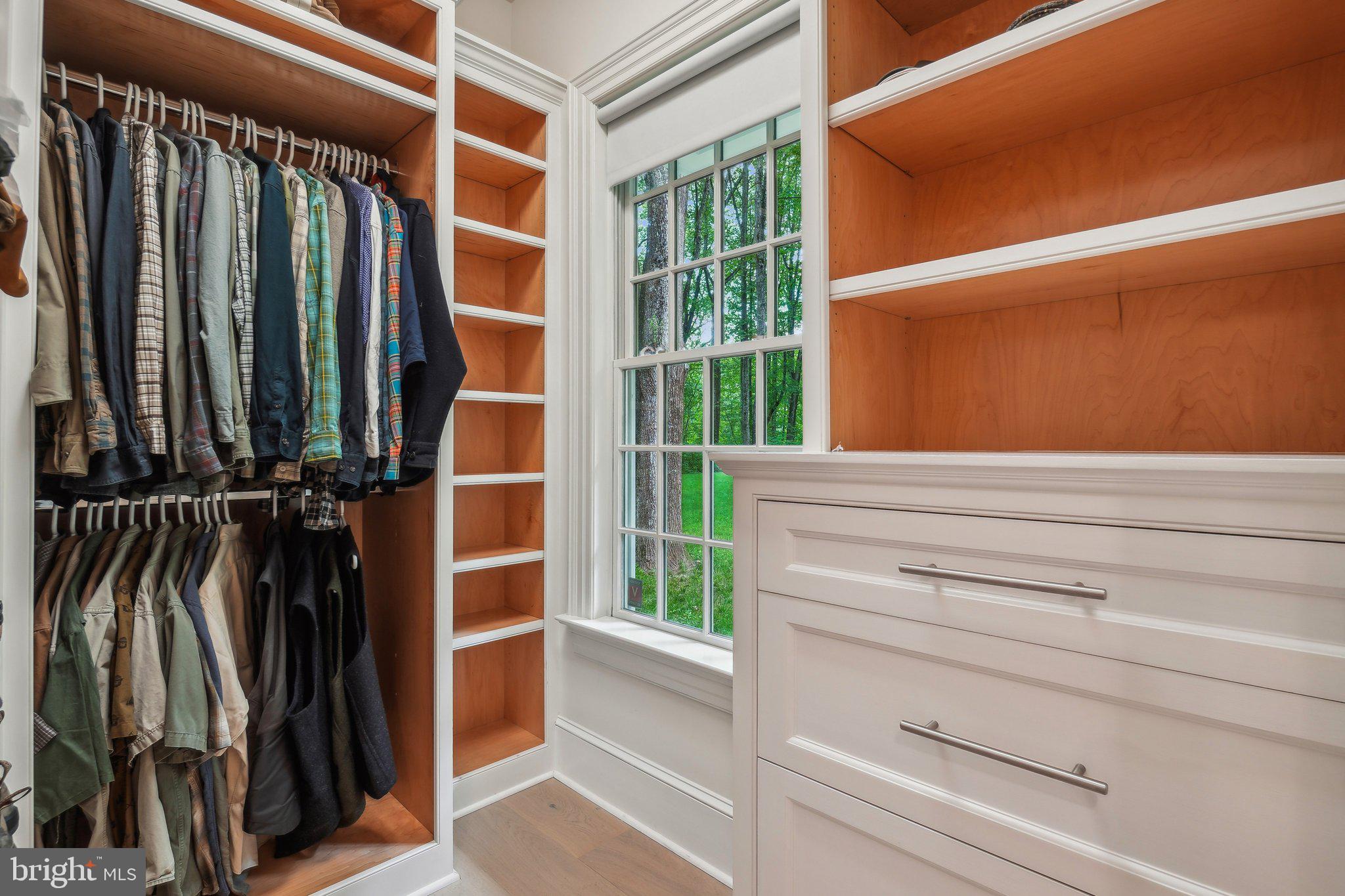 8683 Reservoir Road Fulton, MD 20759 - Photo 35 of 60 a view of walk in closet with clothes and shoes
