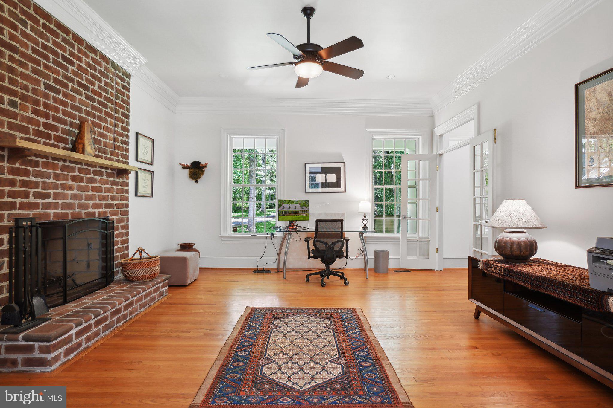 8683 Reservoir Road Fulton, MD 20759 - Photo 36 of 60 a living room with furniture and a fireplace