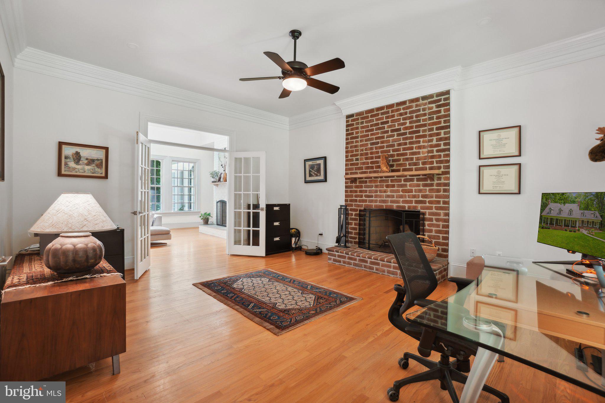 8683 Reservoir Road Fulton, MD 20759 - Photo 37 of 60 a living room with furniture and a fireplace
