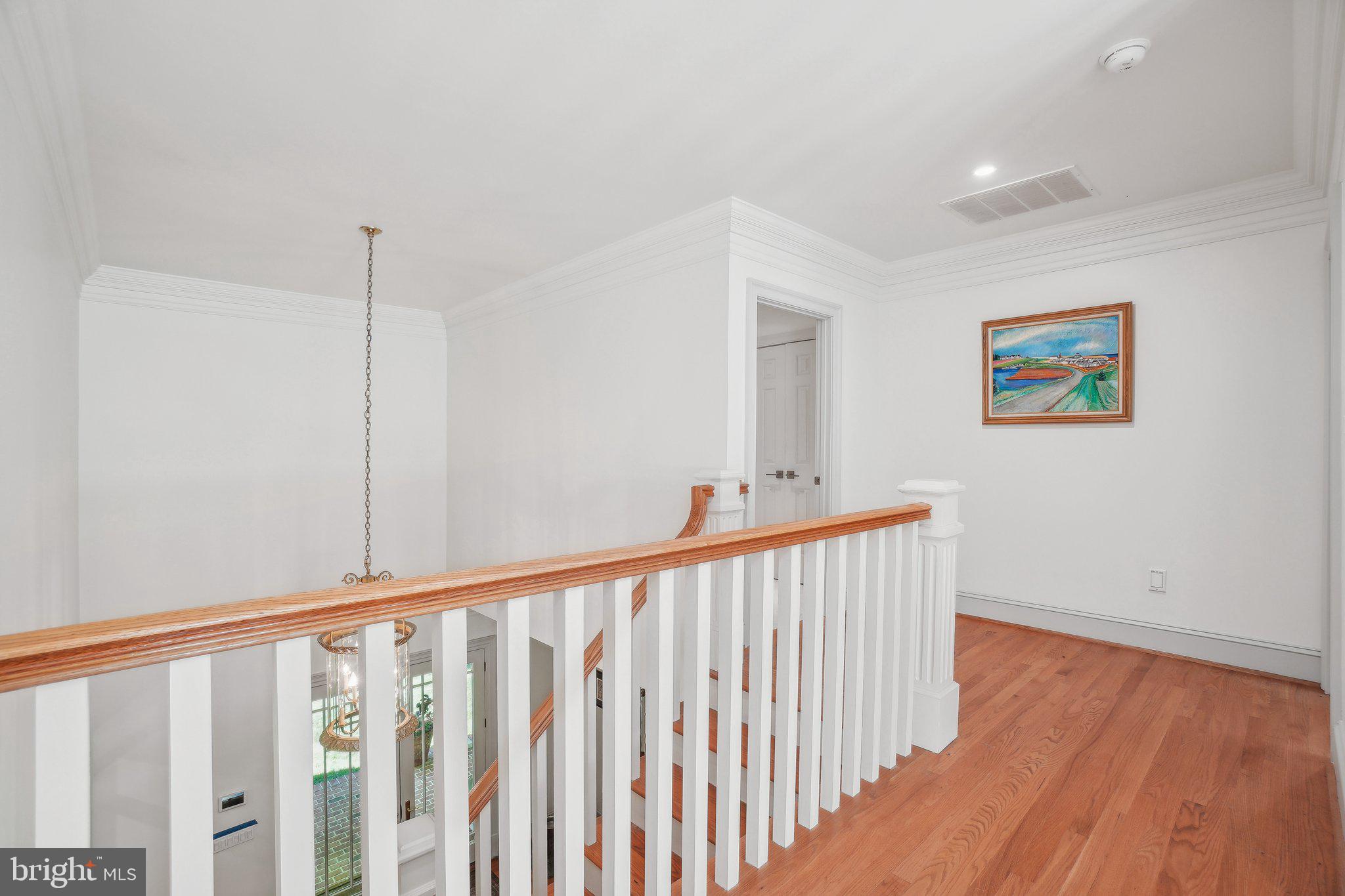 8683 Reservoir Road Fulton, MD 20759 - Photo 39 of 60 a view of a hallway with wooden floor