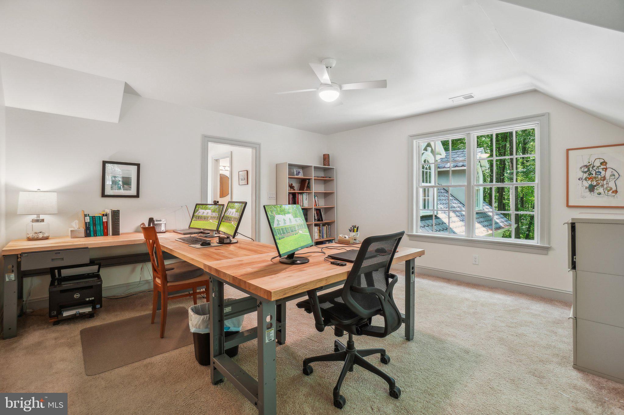 8683 Reservoir Road Fulton, MD 20759 - Photo 40 of 60 a view of a workspace with furniture and a window