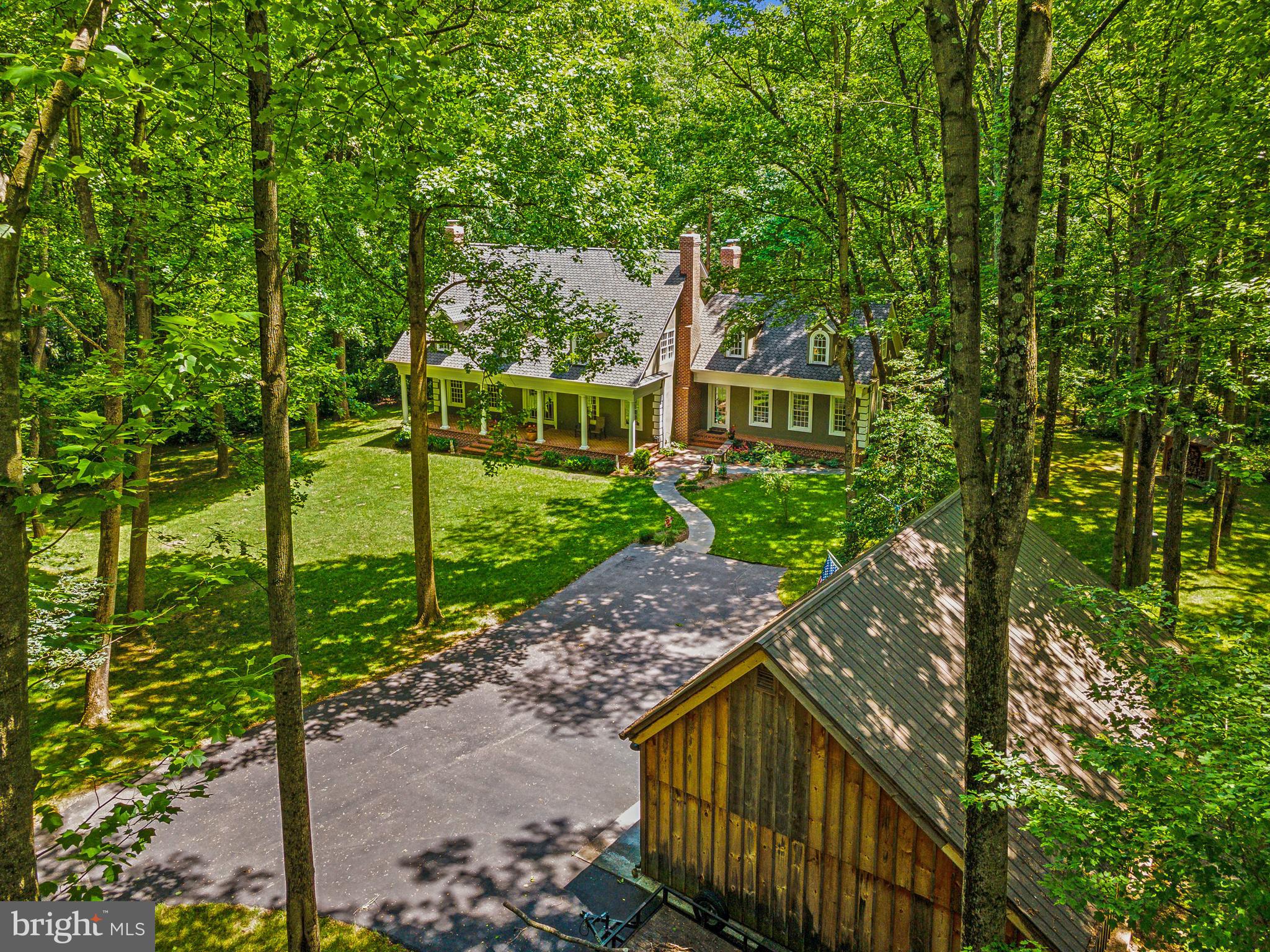 8683 Reservoir Road Fulton, MD 20759 - Photo 4 of 60 a view of a house with a small yard and a garden