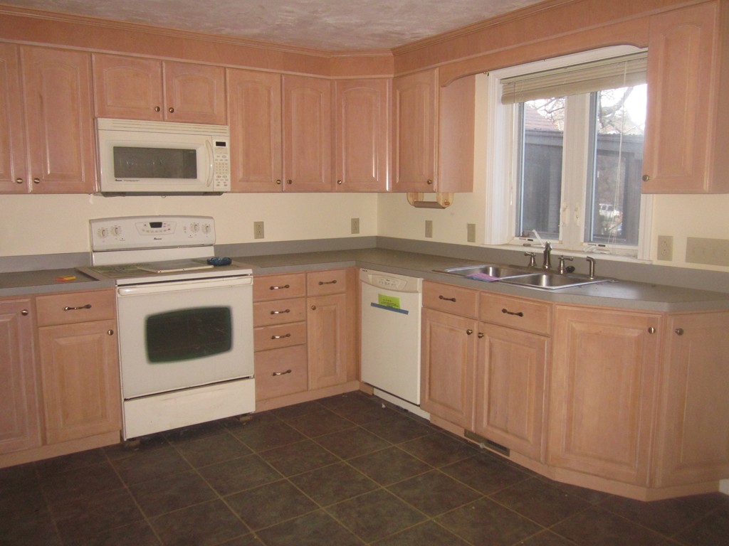 28 Shawsheen Road Billerica, MA 01821 - Photo 2 of 16 a kitchen with white cabinets sink and white appliances