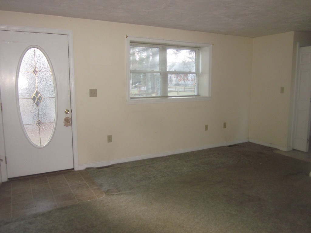 28 Shawsheen Road Billerica, MA 01821 - Photo 3 of 16 an empty room with a white door and a window
