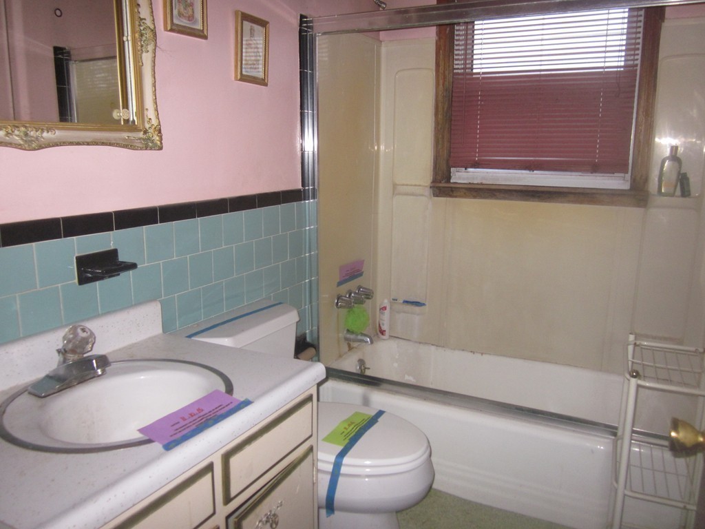 28 Shawsheen Road Billerica, MA 01821 - Photo 10 of 16 a bathroom with a sink a bathtub and a toilet