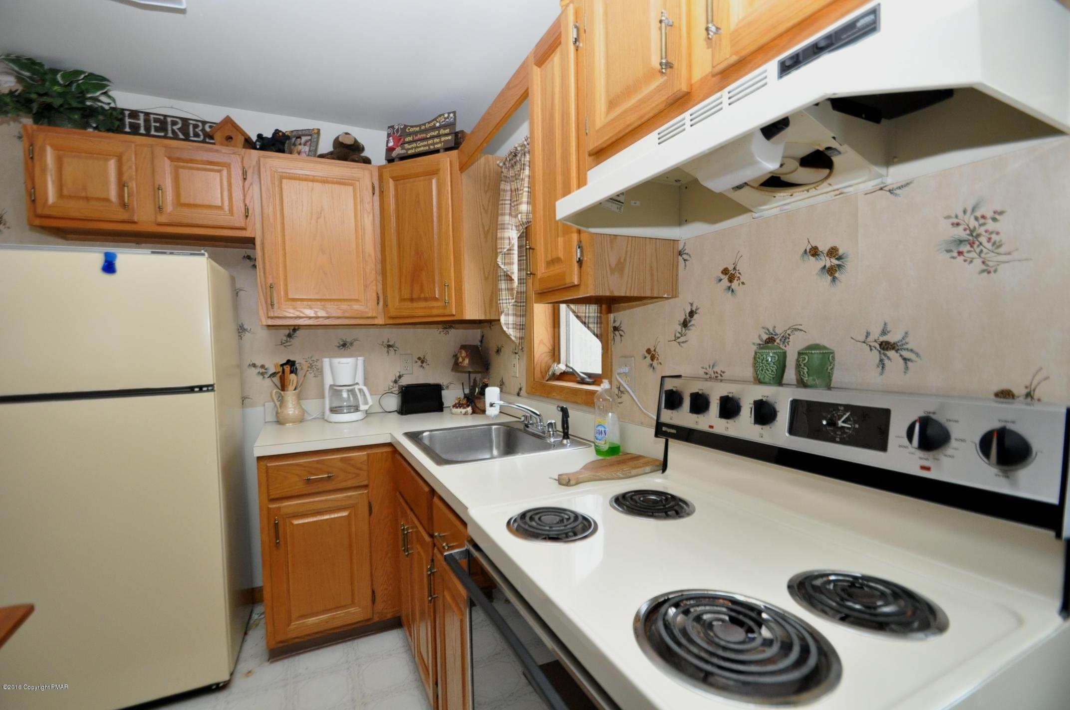 2 Brier Crest Road Blakeslee, PA 18610 - Photo 7 of 15 a kitchen with a white stove top oven and refrigerator