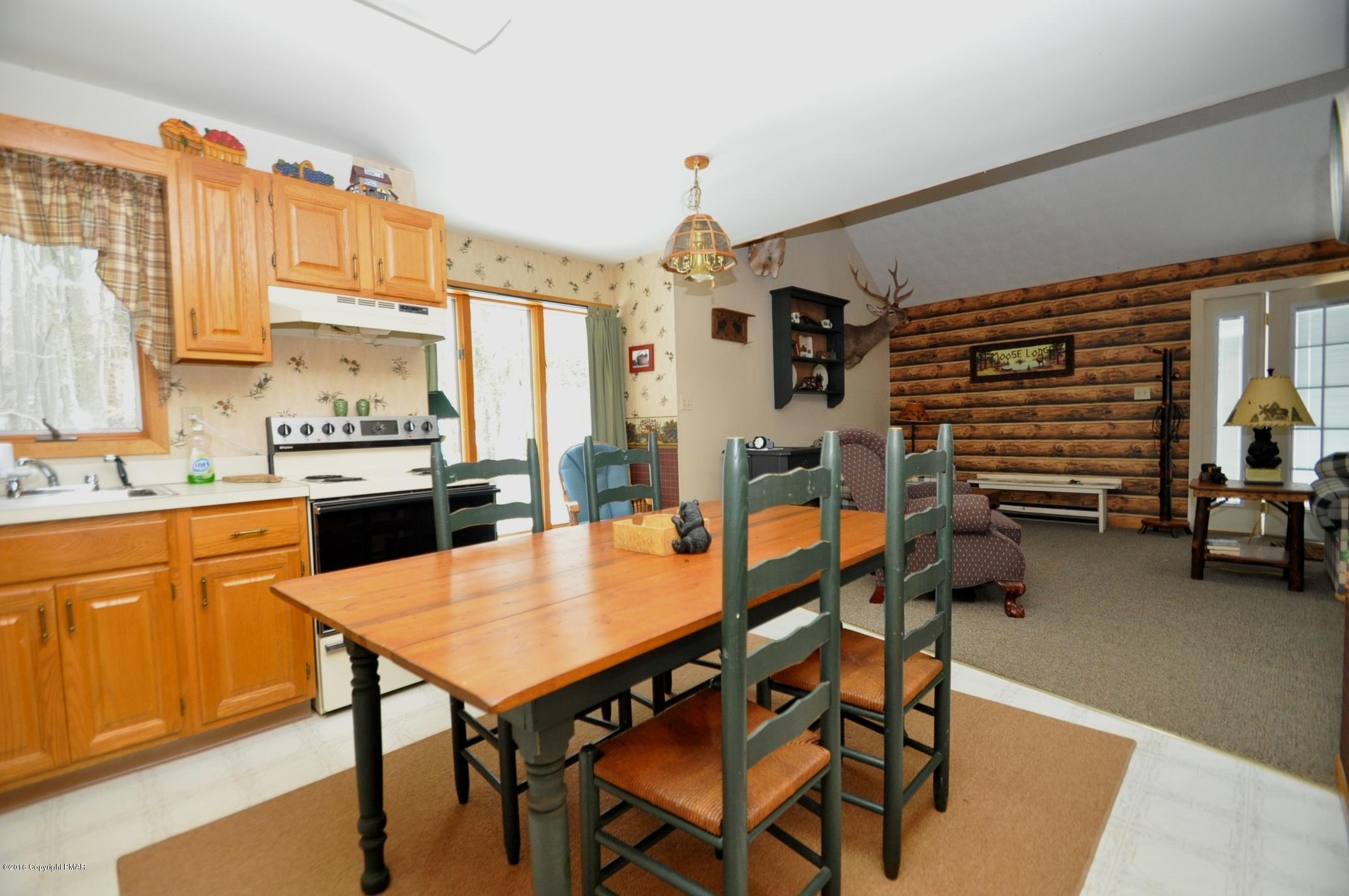 2 Brier Crest Road Blakeslee, PA 18610 - Photo 8 of 15 a dining hall with stainless steel appliances kitchen island granite countertop furniture and a kitchen view