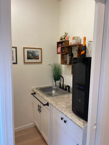 a white toilet sitting next to a bathroom sink