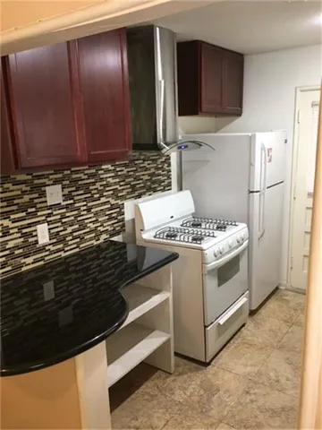 a kitchen with a stove and a microwave