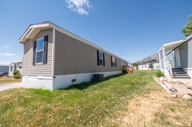 2491 Highway 89, Unit 403 Pleasant View, UT 84404 - Photo 31 of 32 Single-story residence featuring light beige horizontal siding and a white trim