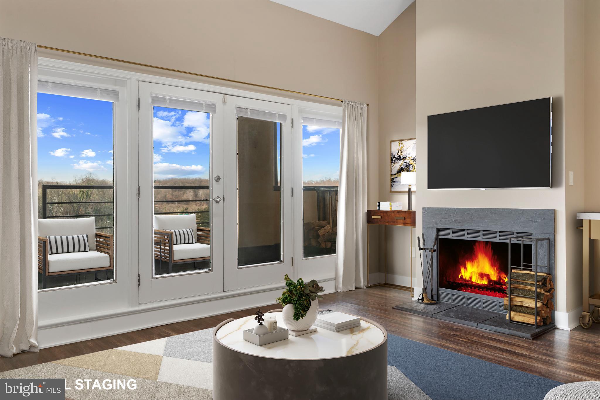 1040 Deer Ridge Drive, Unit 516 Baltimore, MD 21210 - Photo 8 of 33 Living/Dining Area with Wood Burning Fireplace
