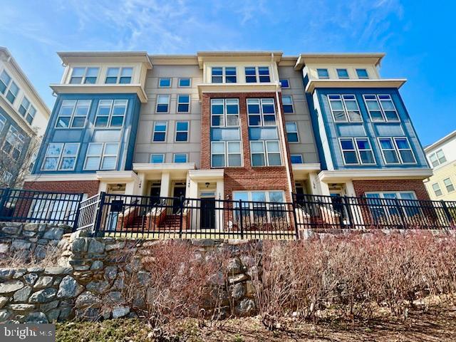 140 Copley Circle, Unit 22B Gaithersburg, MD 20878 - Photo 1 of 36 a view of a brick building next to a yard