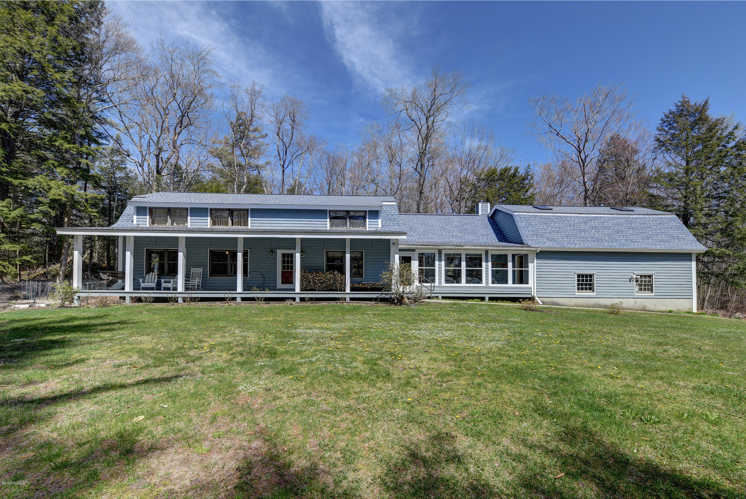 251 Captain Whitney Road Becket, MA 01223 - Photo 1 of 37 a front view of a house with a garden