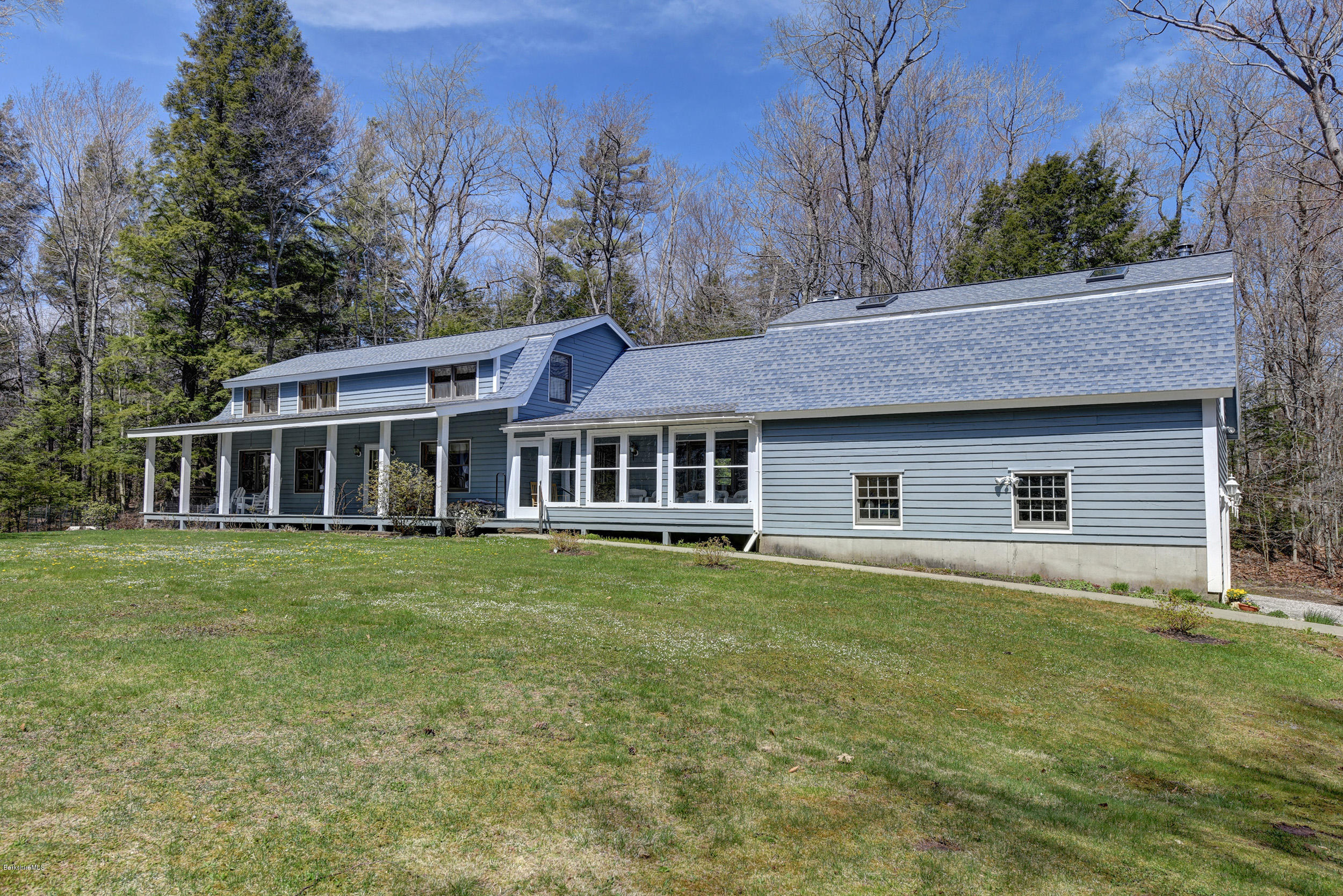 251 Captain Whitney Road Becket, MA 01223 - Photo 2 of 37 a front view of a house with a garden