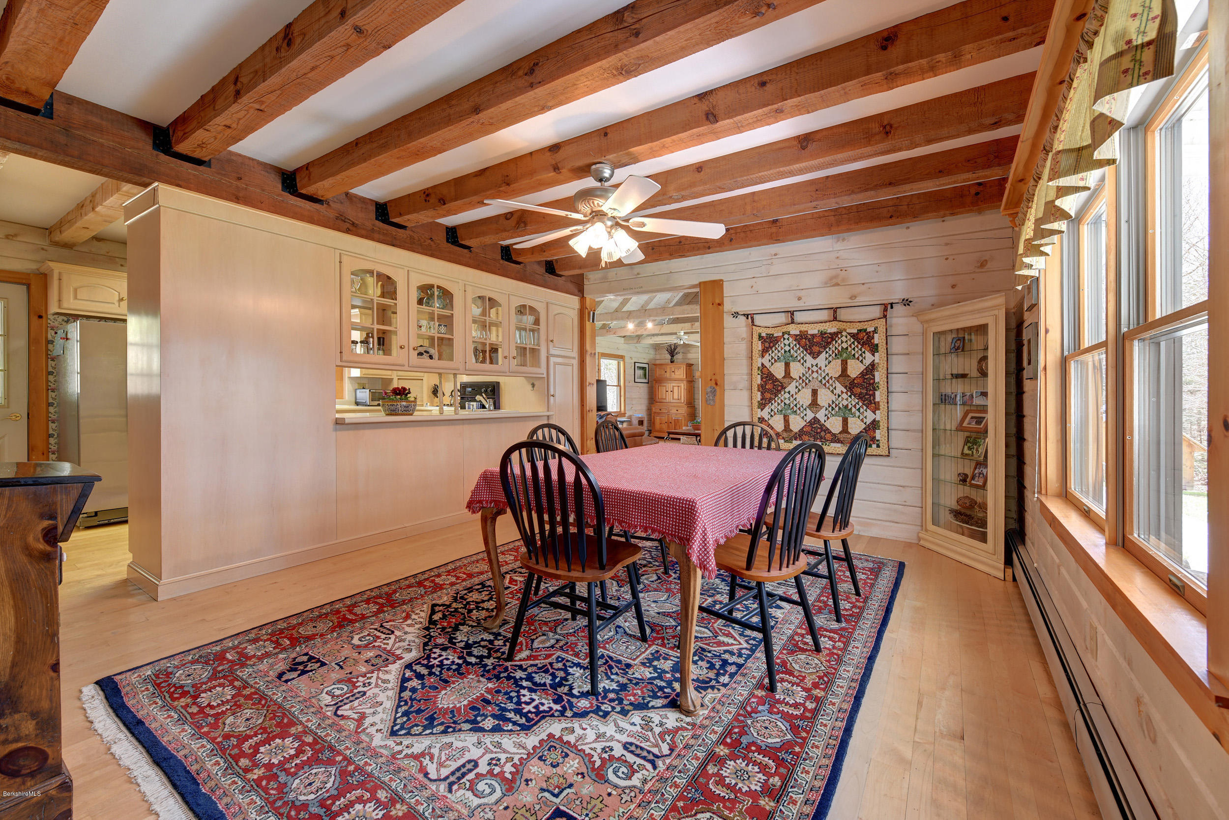 251 Captain Whitney Road Becket, MA 01223 - Photo 11 of 37 a view of a dining room with furniture window and wooden floor