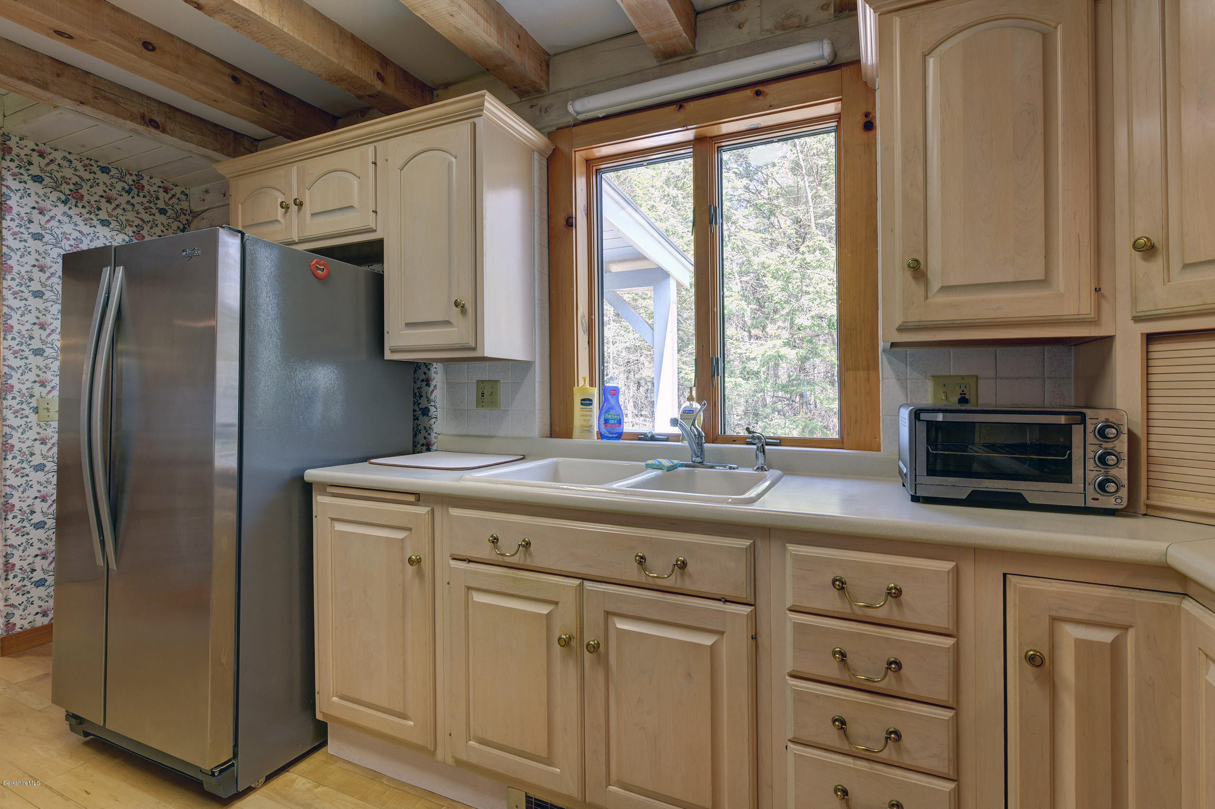 251 Captain Whitney Road Becket, MA 01223 - Photo 12 of 37 a kitchen with stainless steel appliances granite countertop a refrigerator sink and cabinets