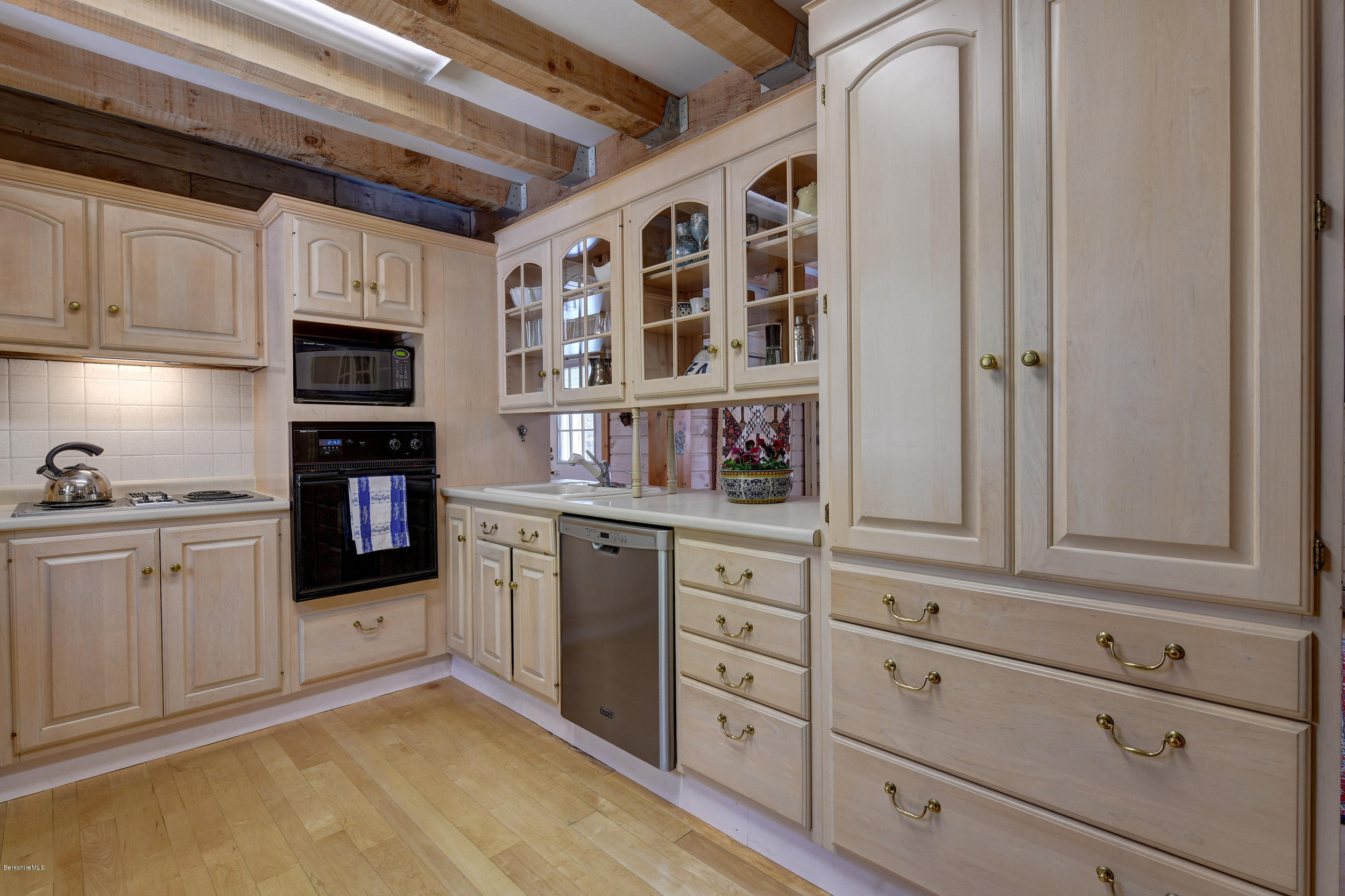 251 Captain Whitney Road Becket, MA 01223 - Photo 13 of 37 a kitchen with stainless steel appliances granite countertop a refrigerator and cabinets