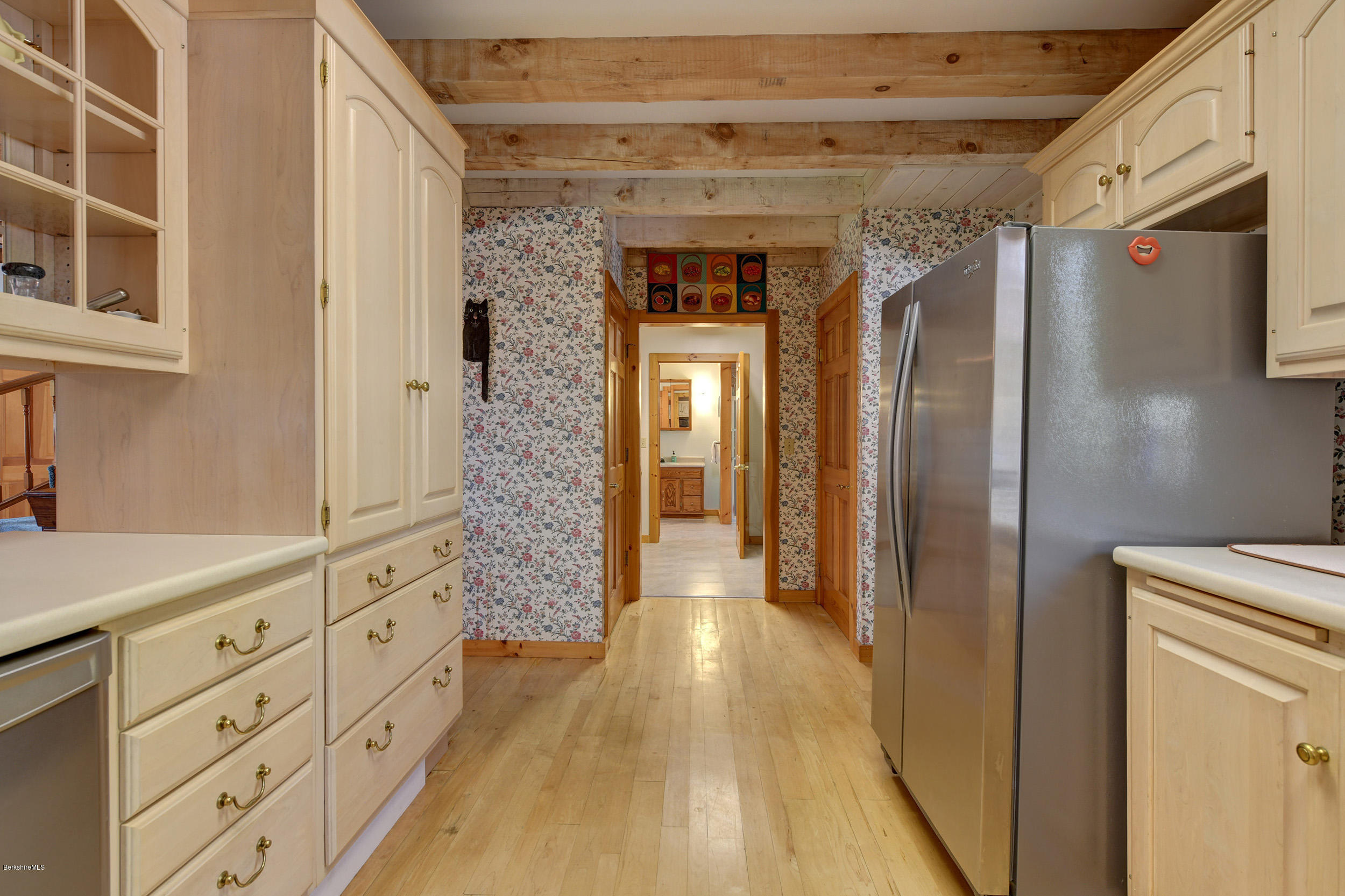 251 Captain Whitney Road Becket, MA 01223 - Photo 15 of 37 a hallway with windows and wooden door