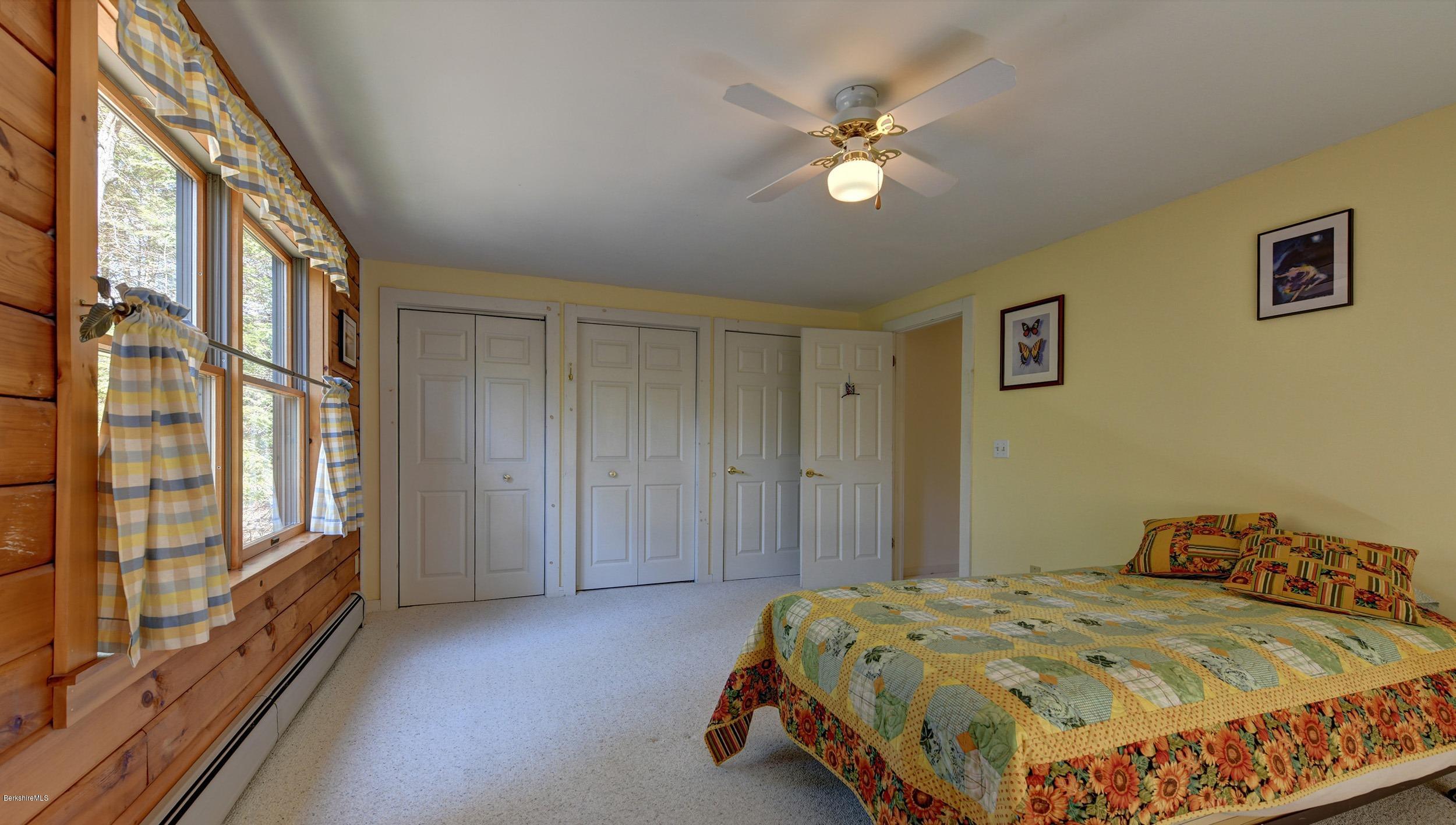 251 Captain Whitney Road Becket, MA 01223 - Photo 25 of 37 a bedroom with a bed and a window