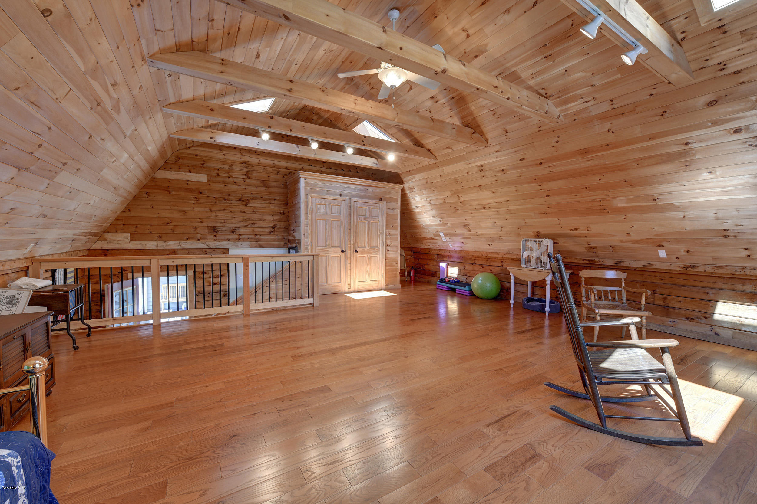 251 Captain Whitney Road Becket, MA 01223 - Photo 31 of 37 a view of a studio with wooden floor