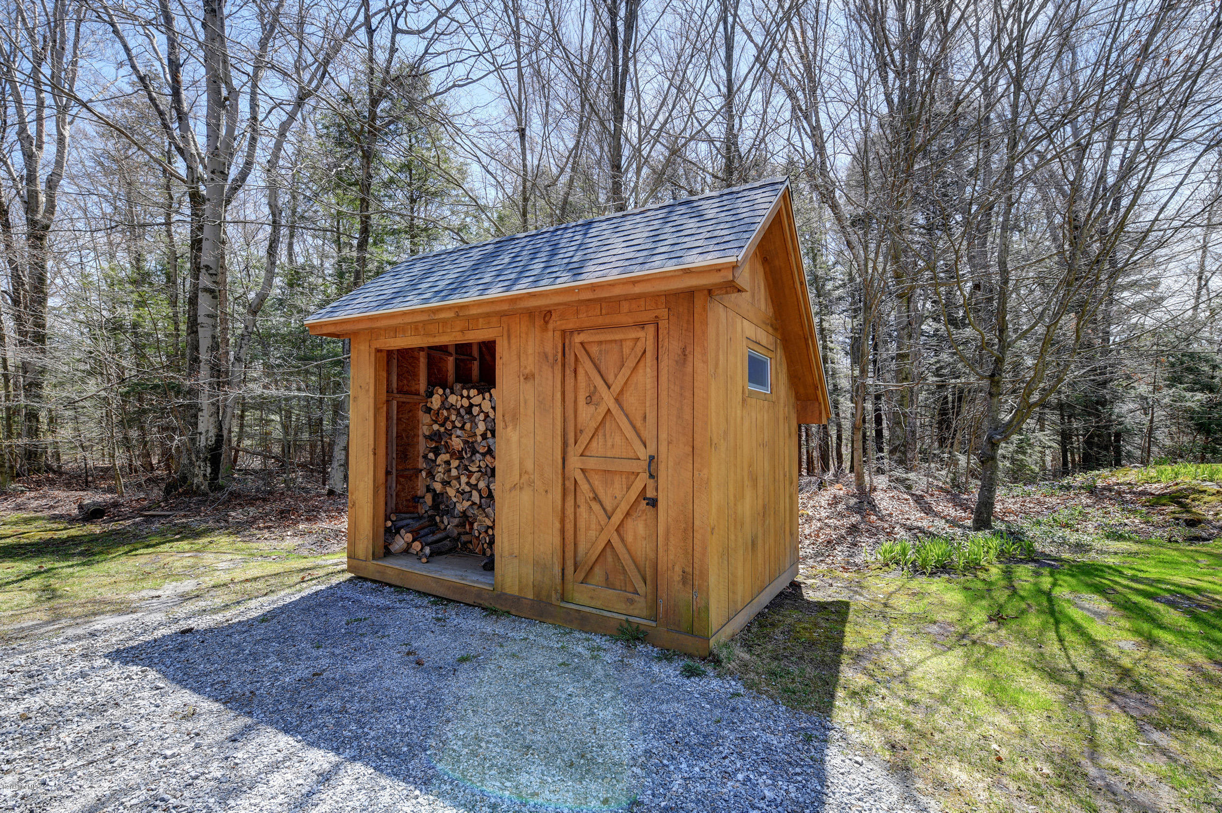 251 Captain Whitney Road Becket, MA 01223 - Photo 37 of 37 a view of a house with backyard and trees