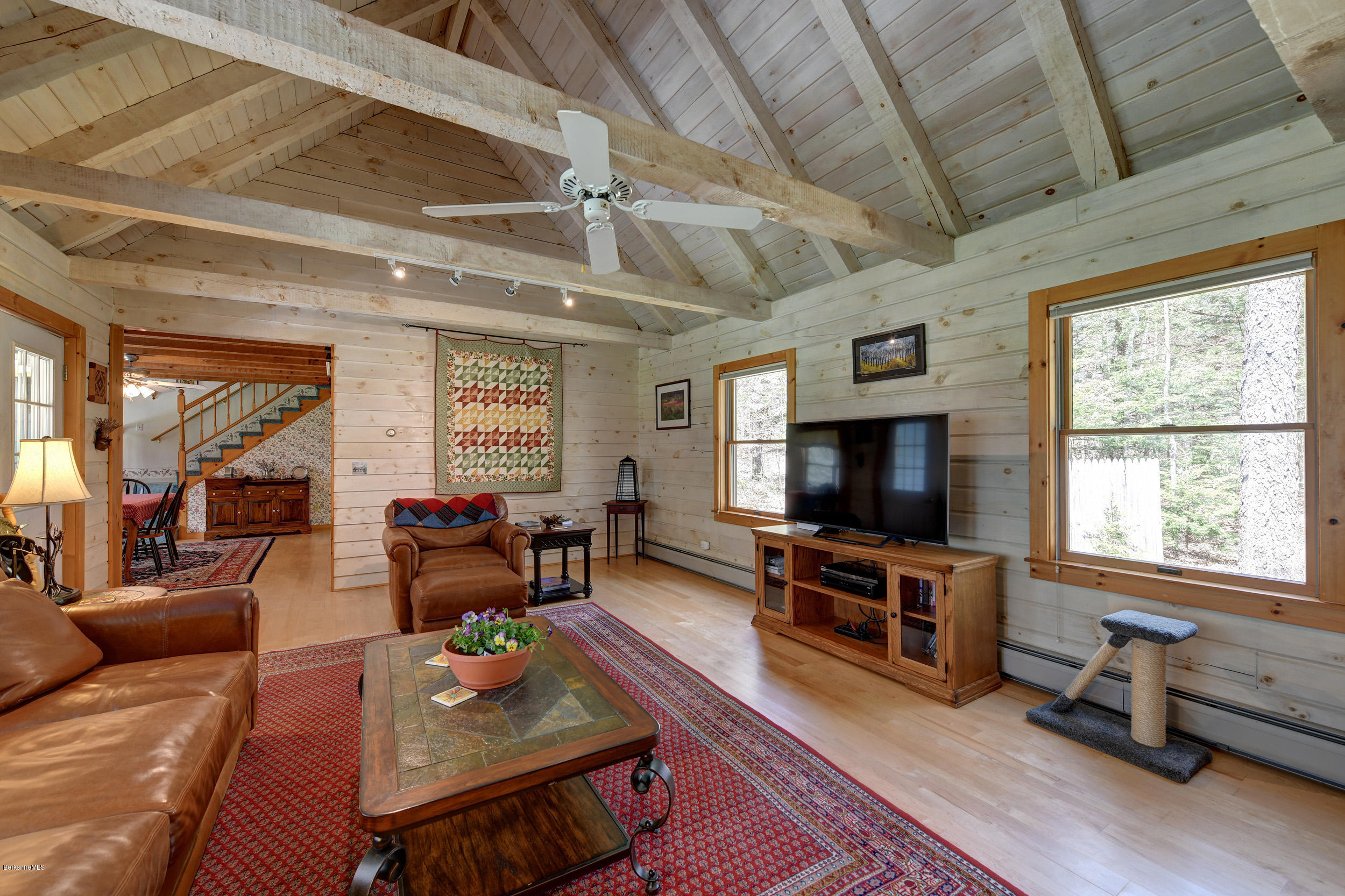 251 Captain Whitney Road Becket, MA 01223 - Photo 9 of 37 a living room with furniture and a flat screen tv