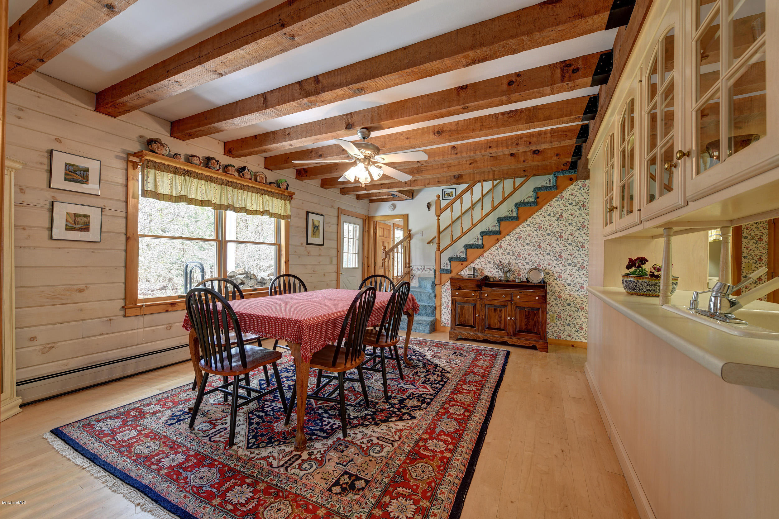251 Captain Whitney Road Becket, MA 01223 - Photo 10 of 37 a view of a dining room with furniture window and wooden floor