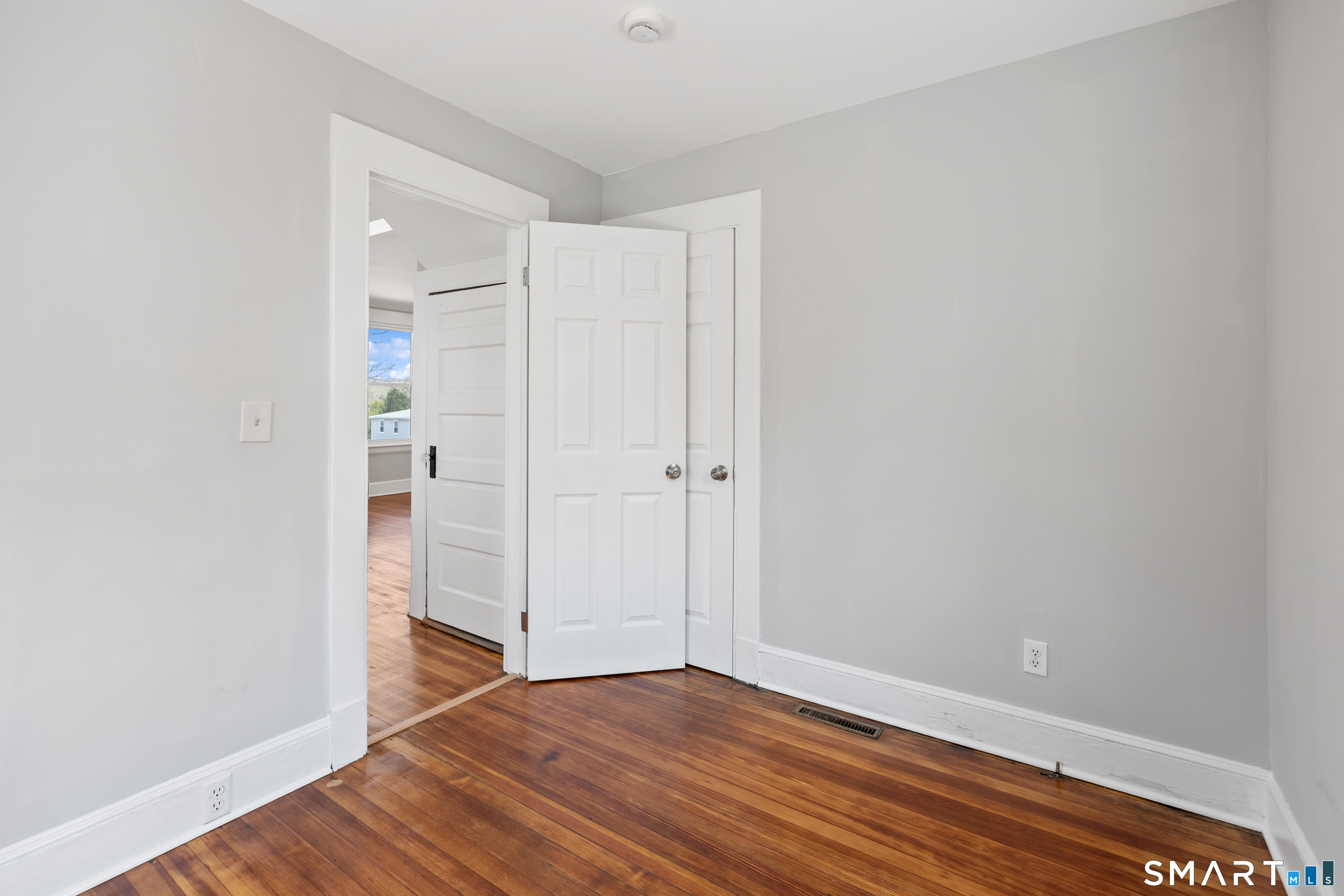 22 Merrimac Street Watertown, CT 06779 - Photo 13 of 17 a view of an empty room with wooden floor and closet