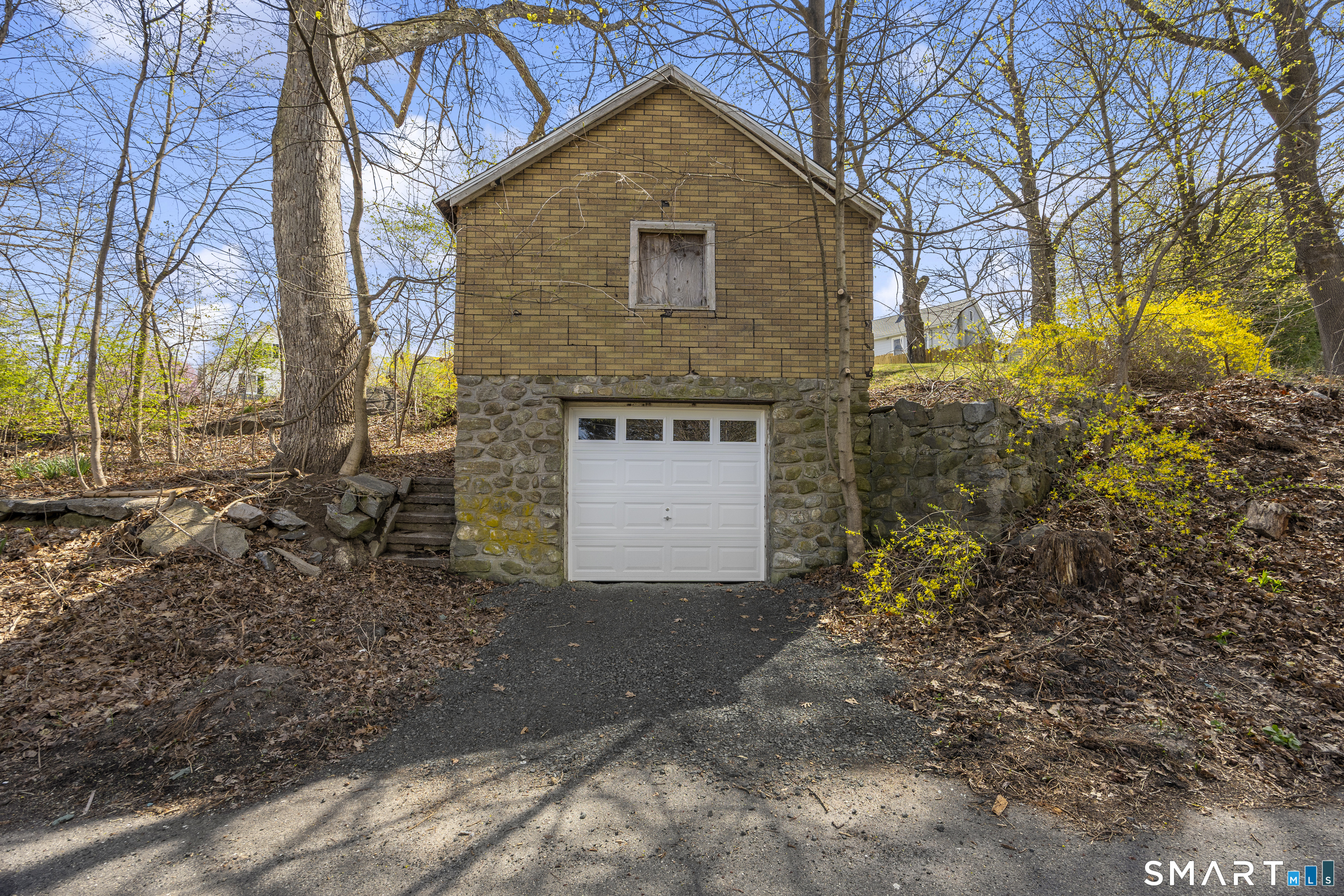 22 Merrimac Street Watertown, CT 06779 - Photo 17 of 17 a front view of a house with a yard and garage