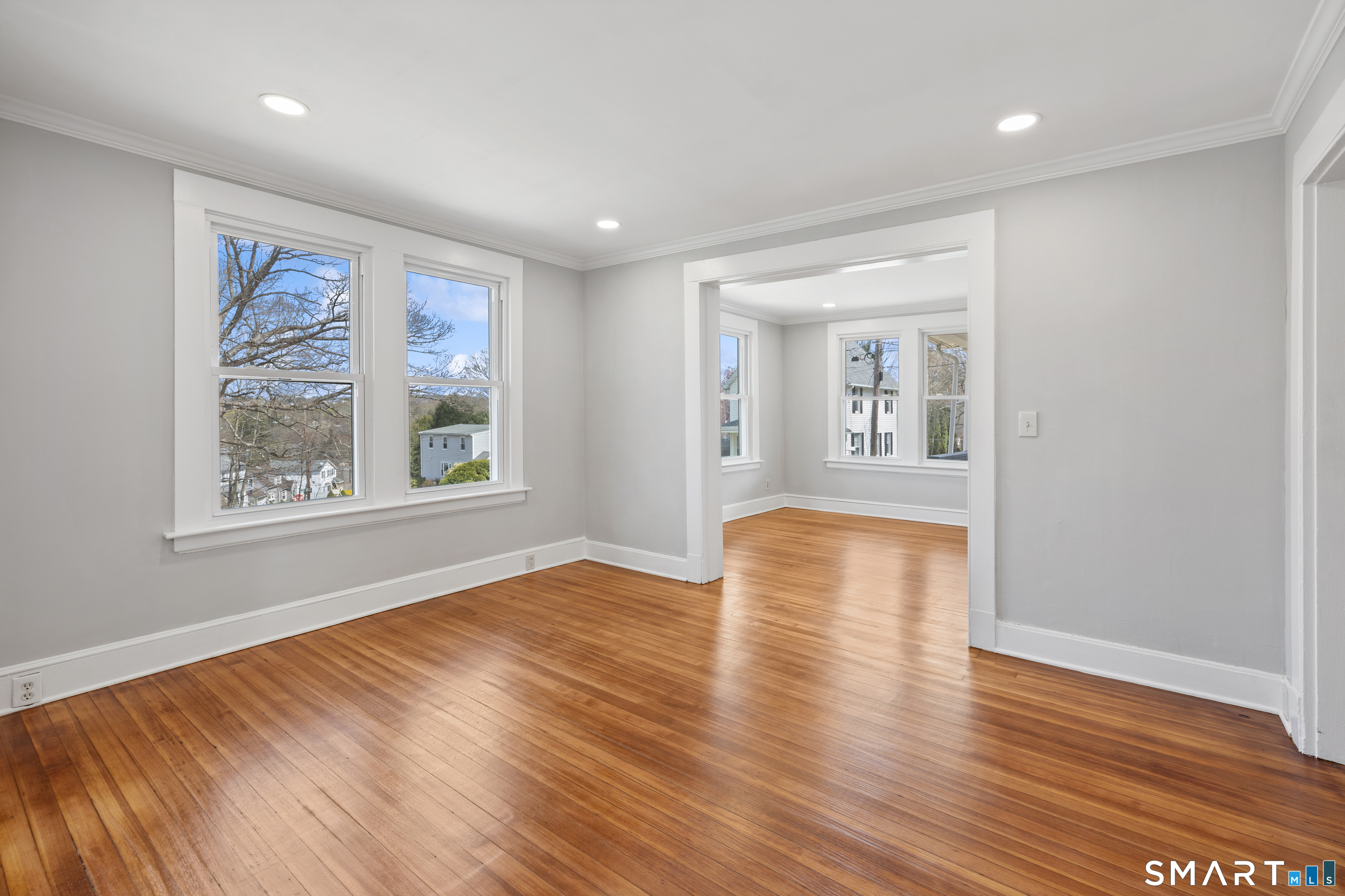 22 Merrimac Street Watertown, CT 06779 - Photo 8 of 17 a view of an empty room with window and wooden floor