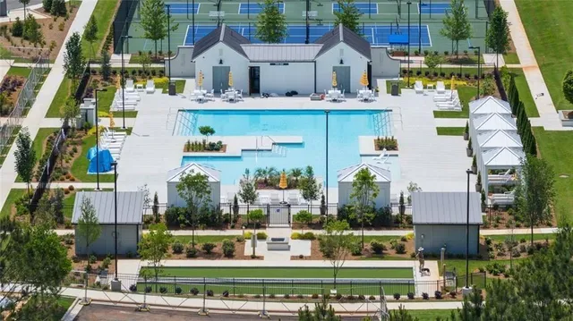 a view of a house with a yard and sitting area