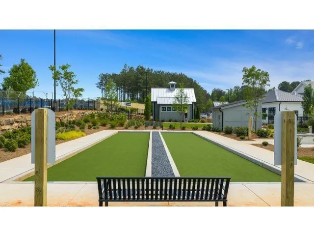 a swimming pool with outdoor seating and yard