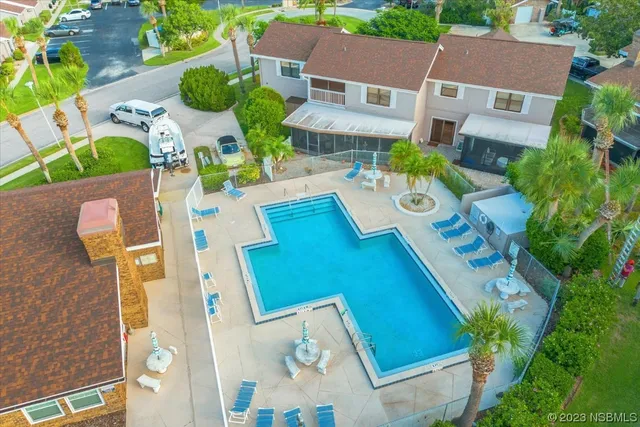 an aerial view of a house with a garden and plants