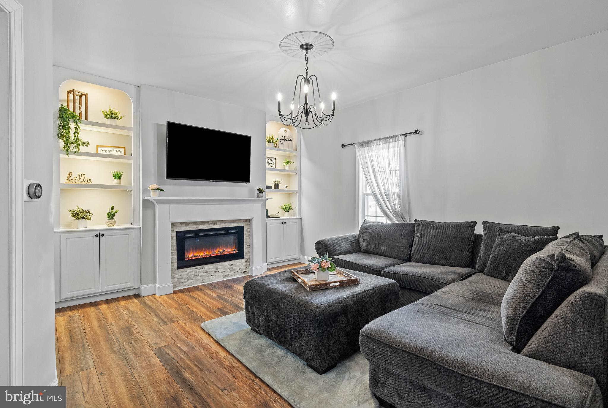 197 Ridge Street Smokerun, PA 16681 - Photo 15 of 47 a living room with furniture a flat screen tv and a fireplace