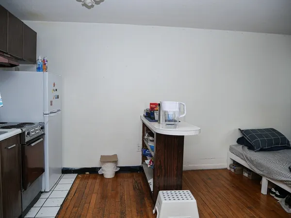 a kitchen with a sink and a stove top oven