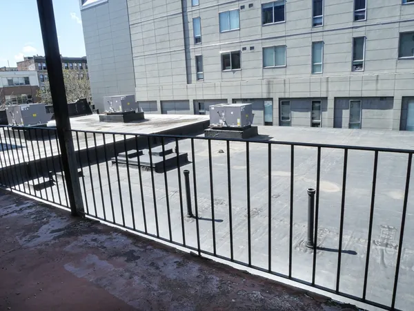 a view of a brick building from a balcony