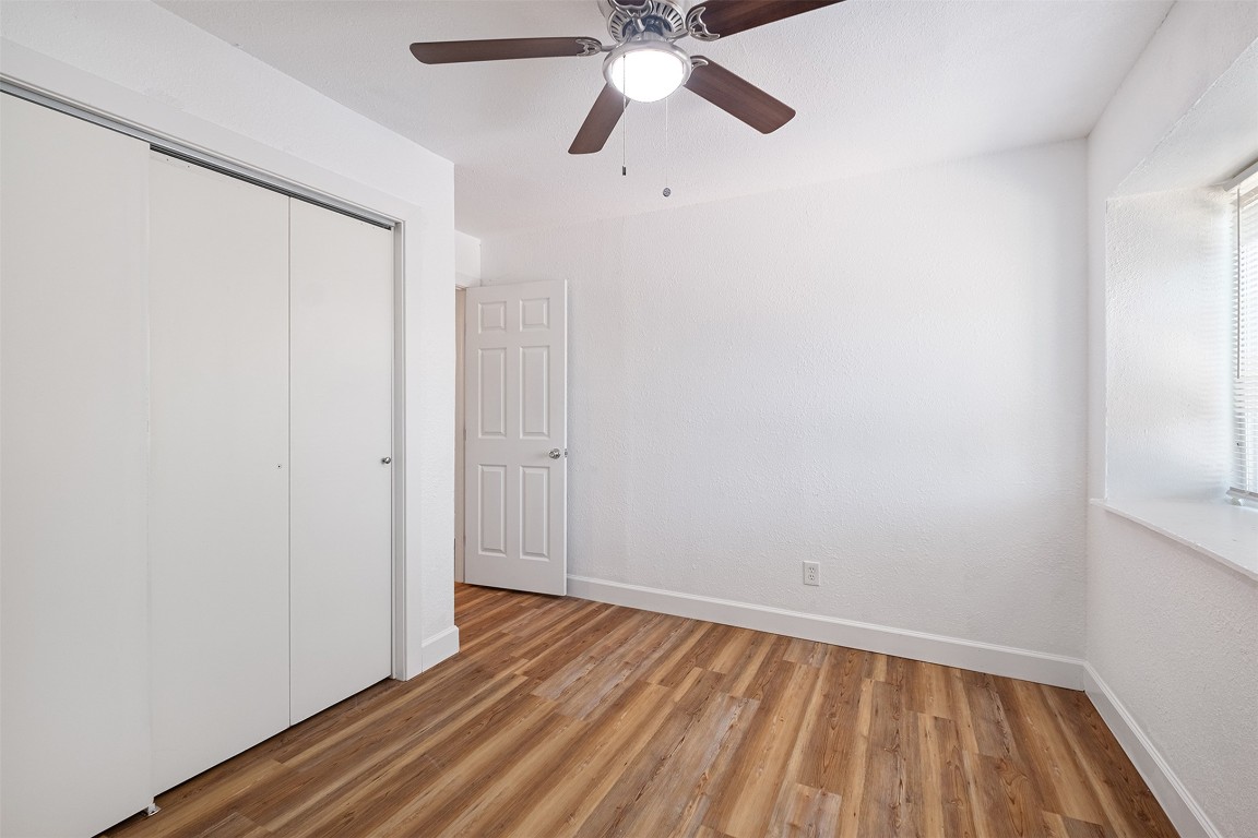 2217 Mission Hill Drive, Unit C Austin, TX 78741 - Photo 12 of 17 a view of room with wooden floor