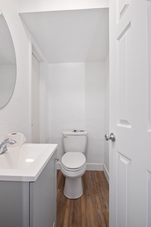 2217 Mission Hill Drive, Unit C Austin, TX 78741 - Photo 10 of 17 a bathroom with a sink a toilet and a mirror