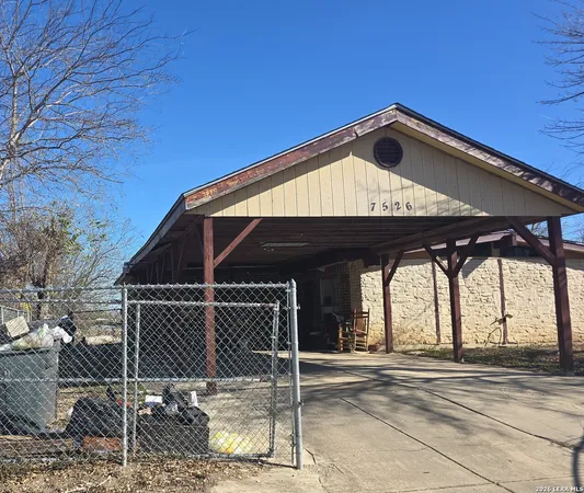 a front view of a house with parking space