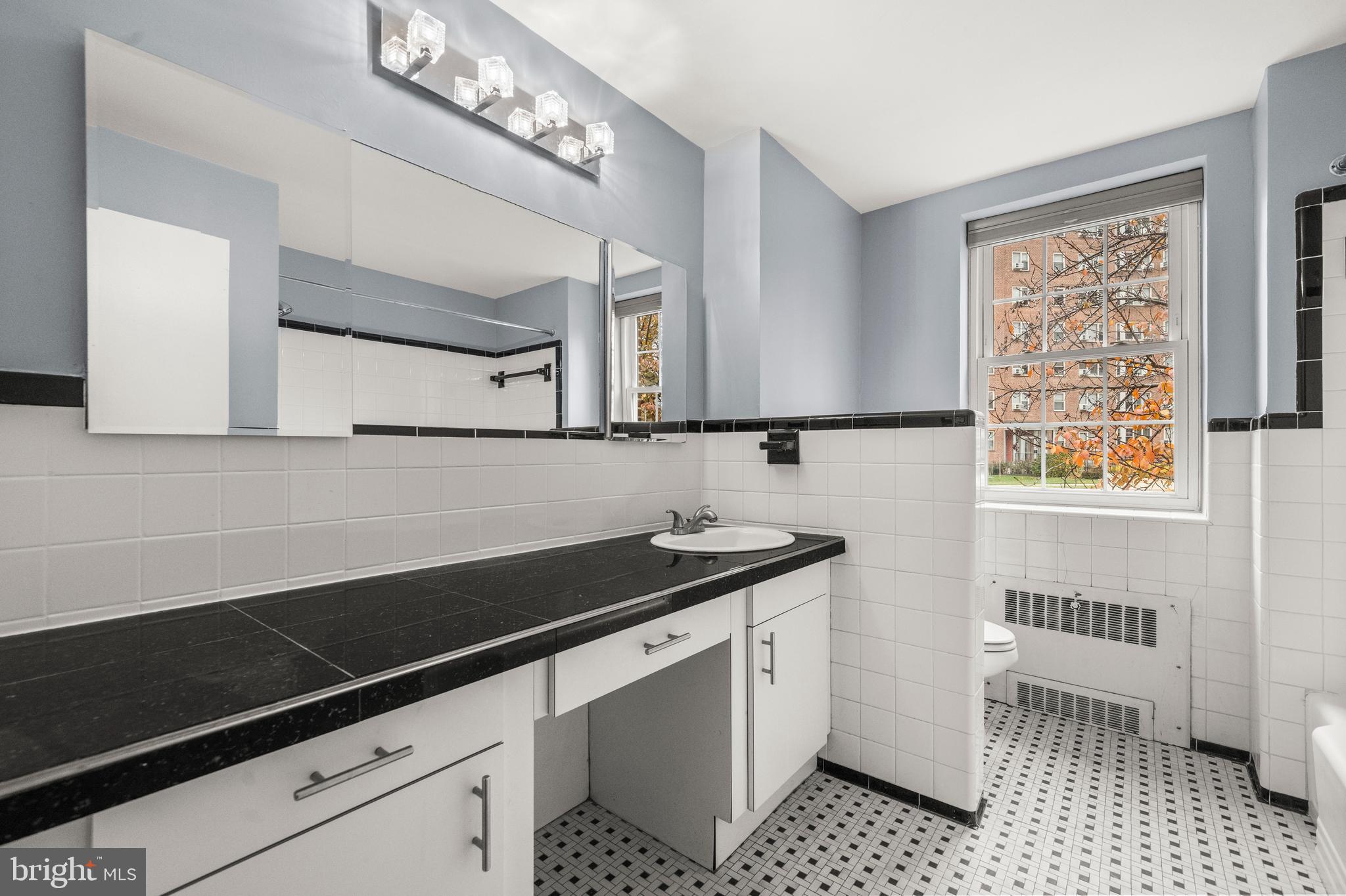 3601 Greenway, Unit 101 Baltimore, MD 21218 - Photo 14 of 32 a kitchen with a sink and cabinets