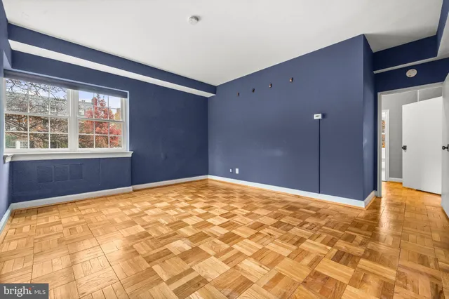 a view of an empty room with a window