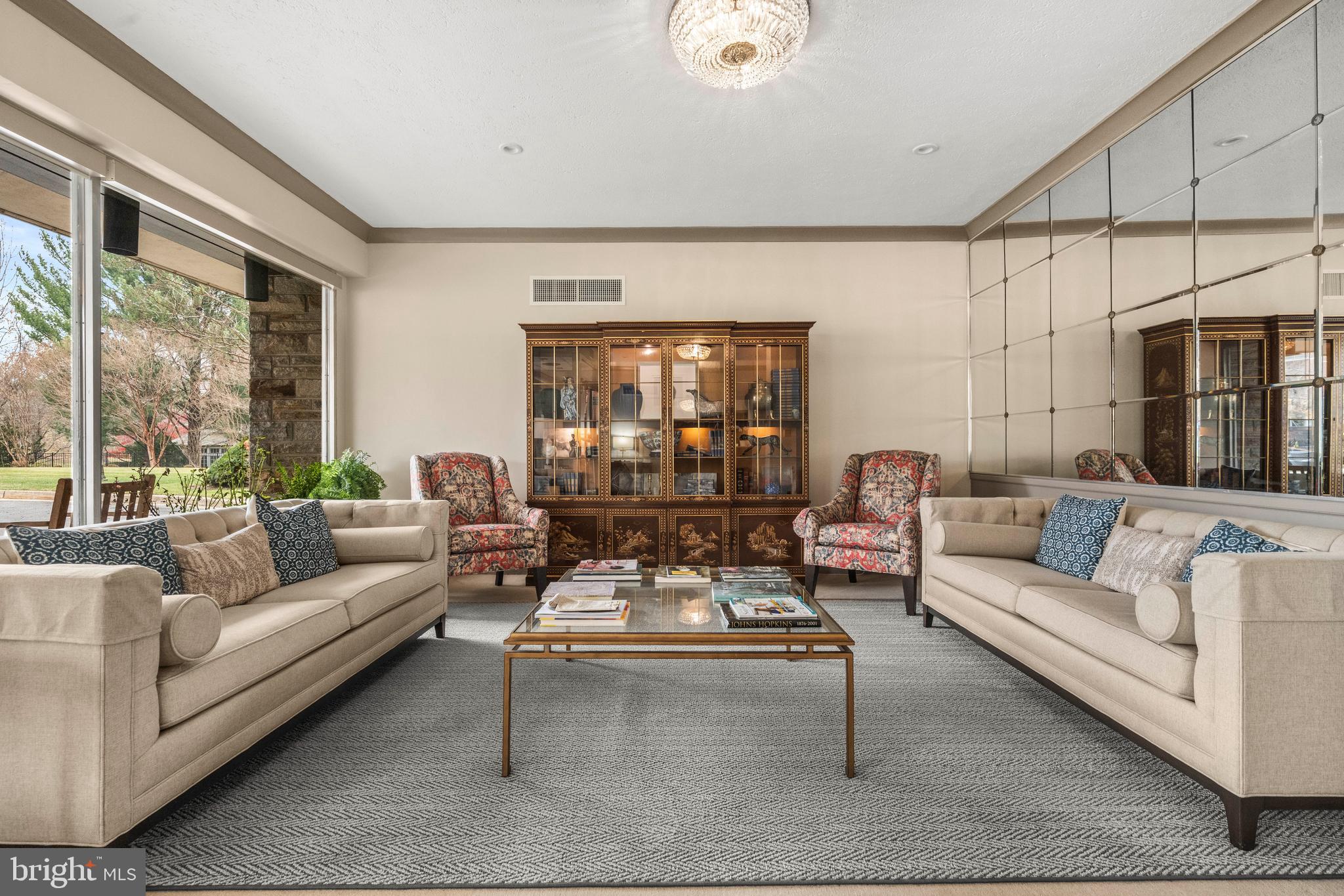 3601 Greenway, Unit 101 Baltimore, MD 21218 - Photo 23 of 32 a living room with furniture and a large window
