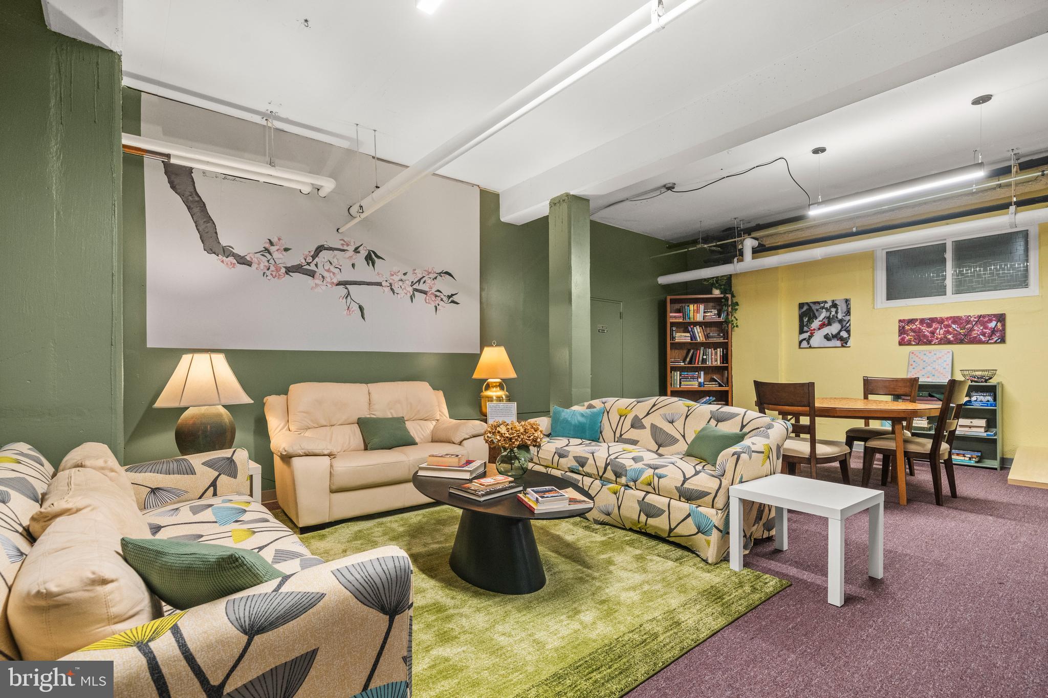 3601 Greenway, Unit 101 Baltimore, MD 21218 - Photo 24 of 32 a living room with furniture and a large window