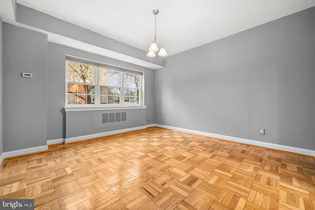 a view of an empty room with a window
