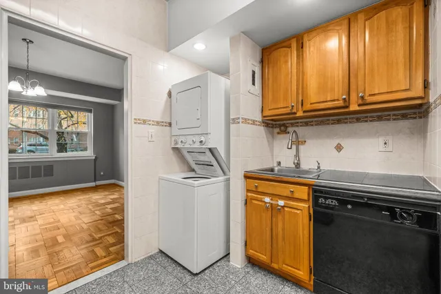 a kitchen with stainless steel appliances granite countertop a refrigerator and stove