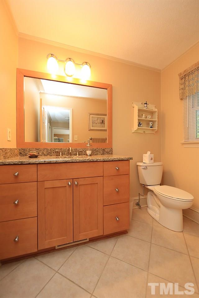 7905 Hardwick Drive Raleigh, NC 27615 - Photo 11 of 26 The half bath has tall vanity, tile floors!
