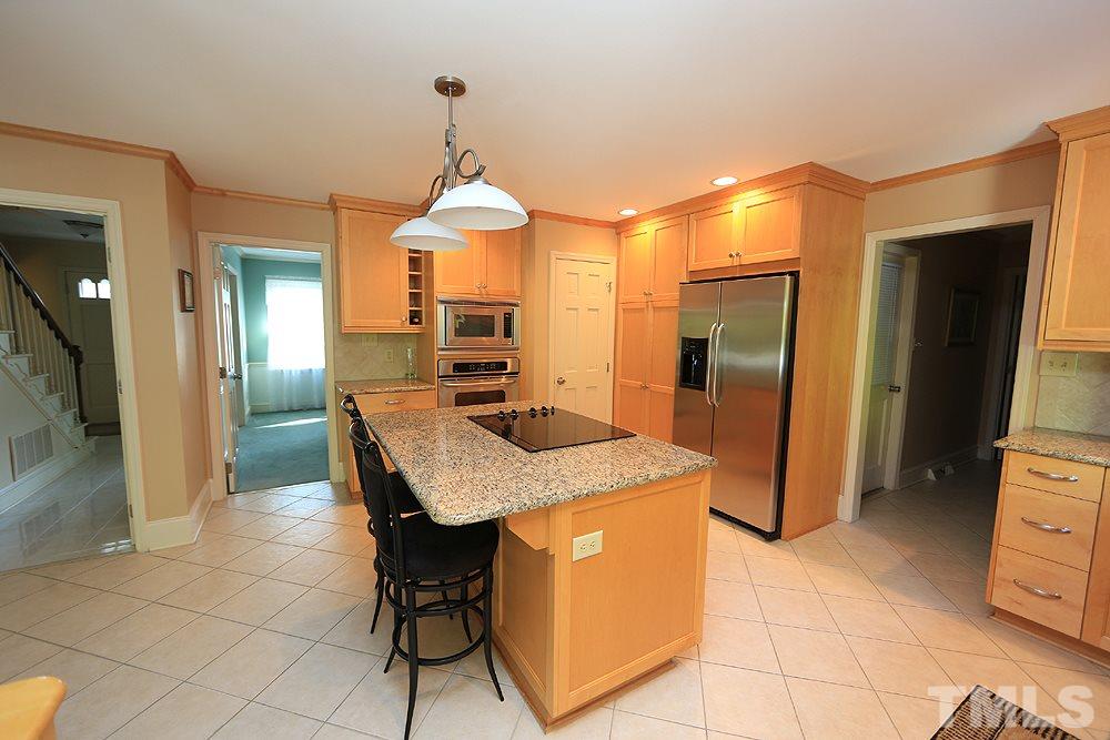 7905 Hardwick Drive Raleigh, NC 27615 - Photo 5 of 26 There is a storage area for vacuum, brooms in addition to the cabinet pantry.